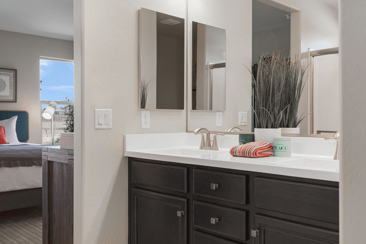 Dual-sink vanity at primary bathroom