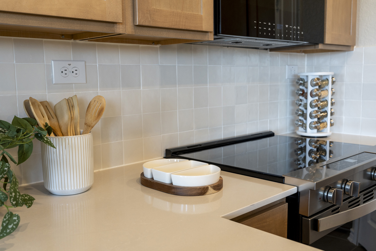 Quartz countertops with tile backsplash